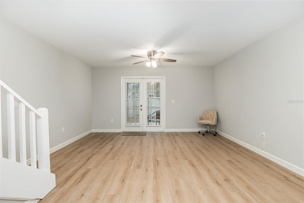 5240 Southwest 92nd Court Gainesville, FL 32608 - Photo 17 of 58 wooden floor in an empty room with a window