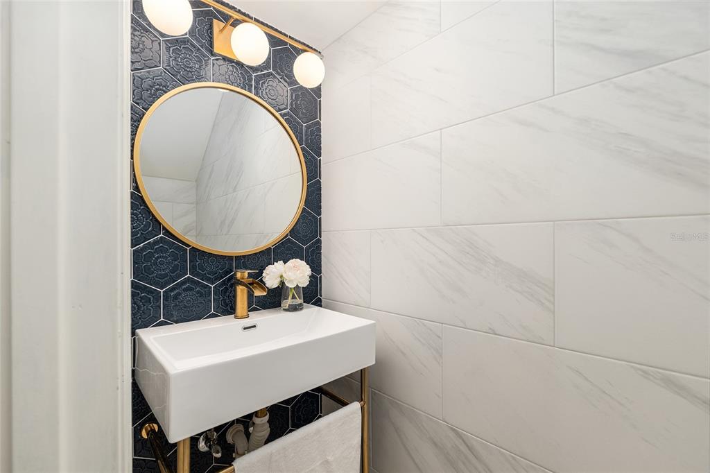 5240 Southwest 92nd Court Gainesville, FL 32608 - Photo 29 of 58 a bathroom with a sink mirror and vanity