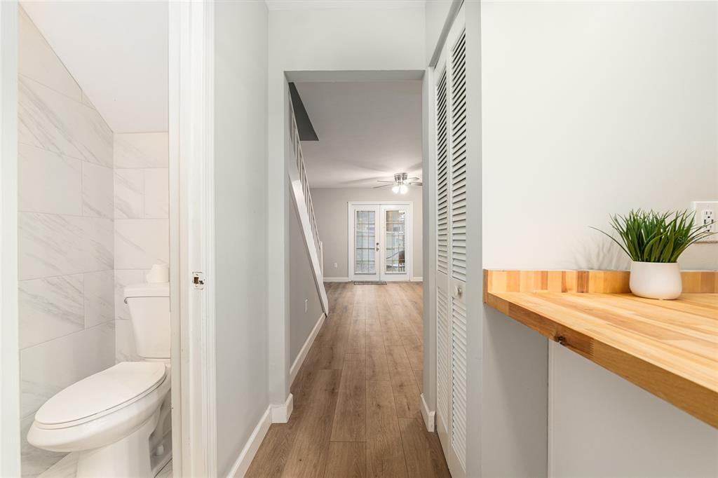 5240 Southwest 92nd Court Gainesville, FL 32608 - Photo 30 of 58 a bathroom with a sink a toilet a mirror and shower