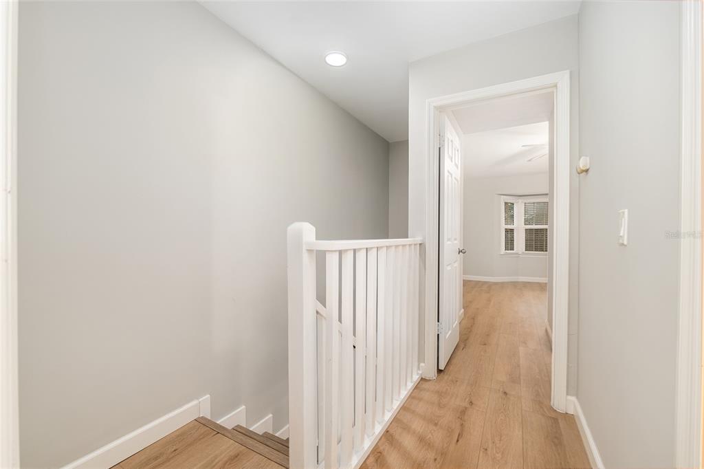 5240 Southwest 92nd Court Gainesville, FL 32608 - Photo 32 of 58 a view of a hallway with wooden floor