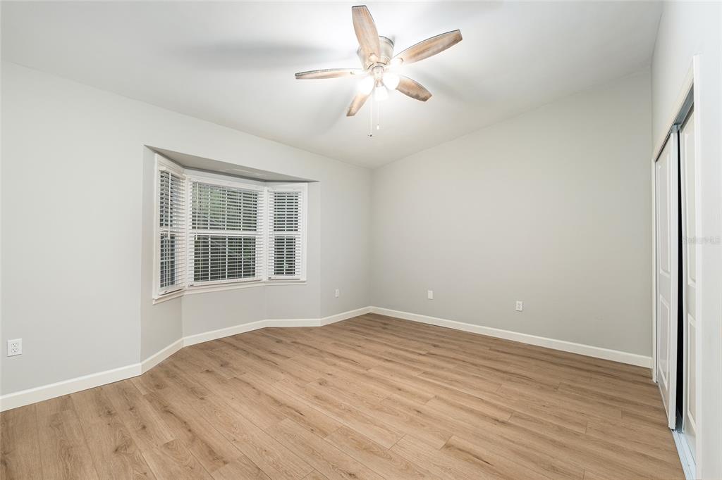 5240 Southwest 92nd Court Gainesville, FL 32608 - Photo 34 of 58 wooden floor in an empty room with a window