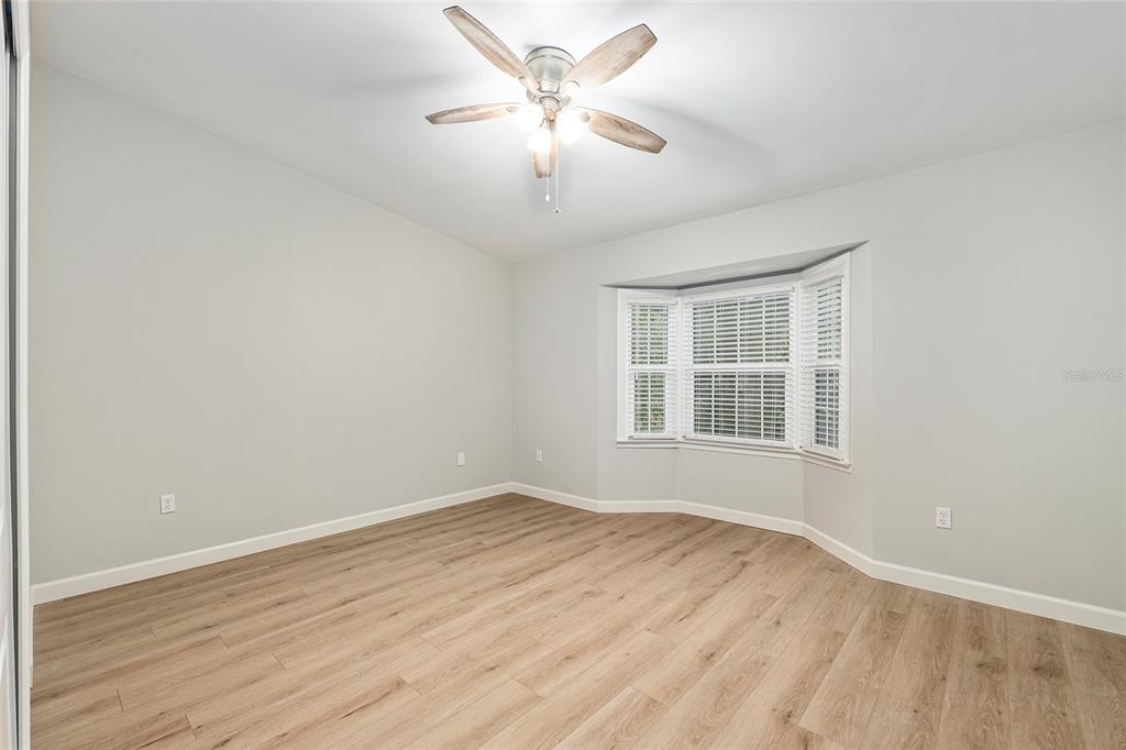 5240 Southwest 92nd Court Gainesville, FL 32608 - Photo 36 of 58 wooden floor in an empty room with a window