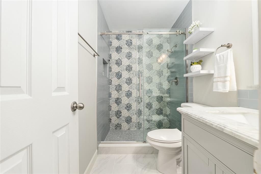 5240 Southwest 92nd Court Gainesville, FL 32608 - Photo 38 of 58 a bathroom with a sink a toilet and shower