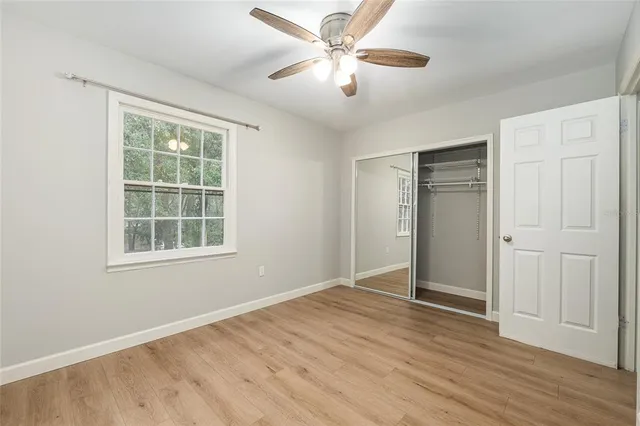 a backyard of a house with barbeque oven table and chairs