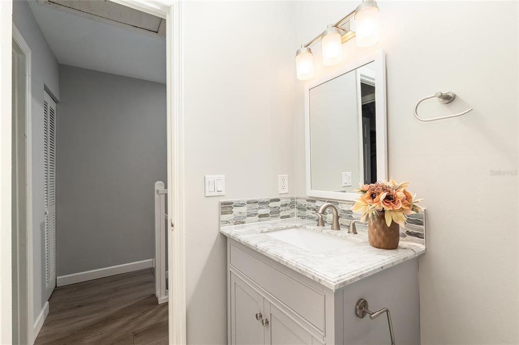 5240 Southwest 92nd Court Gainesville, FL 32608 - Photo 45 of 58 a bathroom with a sink vanity and a mirror