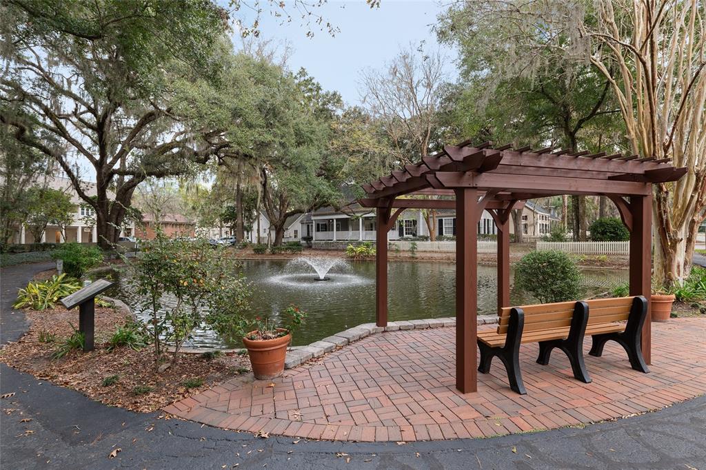 5240 Southwest 92nd Court Gainesville, FL 32608 - Photo 55 of 58 a backyard of a house with barbeque oven table and chairs
