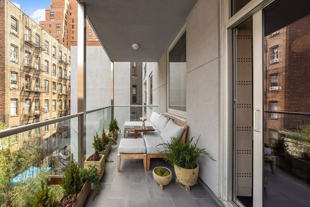 433 East 74th Street, Unit 4A Manhattan, NY 10021 - Photo 15 of 34 a view of a balcony with chairs and potted plants