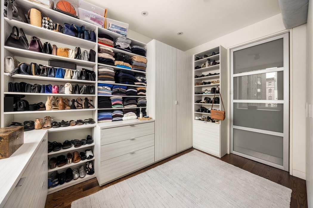 433 East 74th Street, Unit 4A Manhattan, NY 10021 - Photo 19 of 34 a view of walk in closet with clothes and shoes