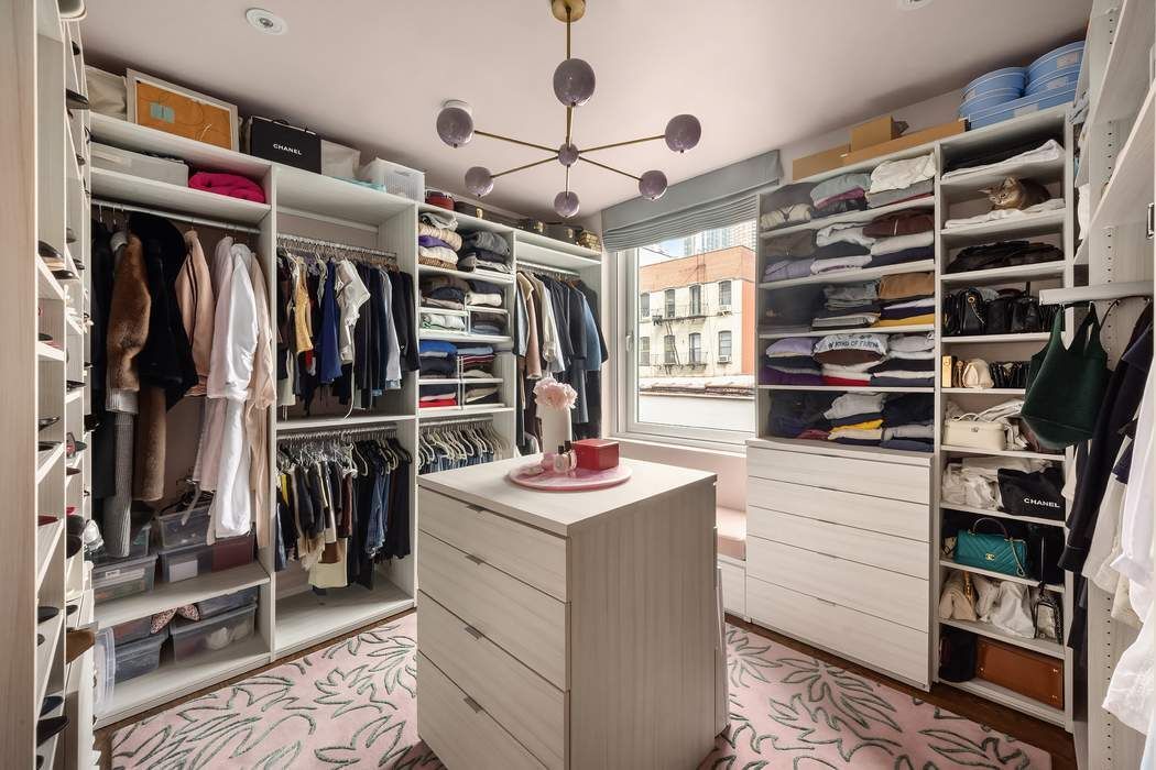 433 East 74th Street, Unit 4A Manhattan, NY 10021 - Photo 22 of 34 a view of walk in closet with clothes and shoes