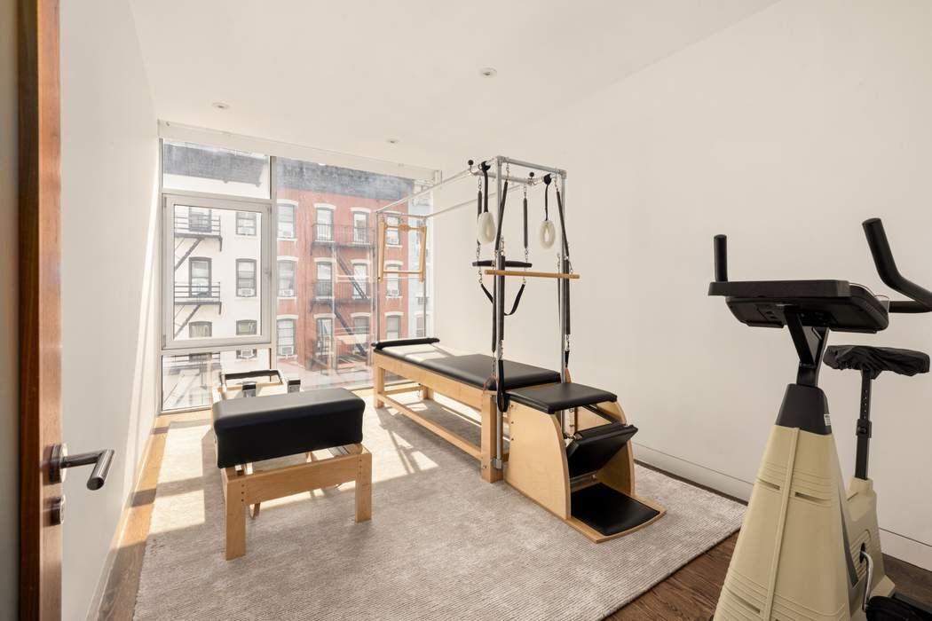 433 East 74th Street, Unit 4A Manhattan, NY 10021 - Photo 27 of 34 a living room with furniture and a window