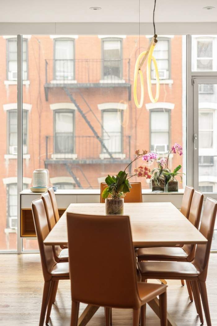 433 East 74th Street, Unit 4A Manhattan, NY 10021 - Photo 5 of 34 a dining room with furniture and windows