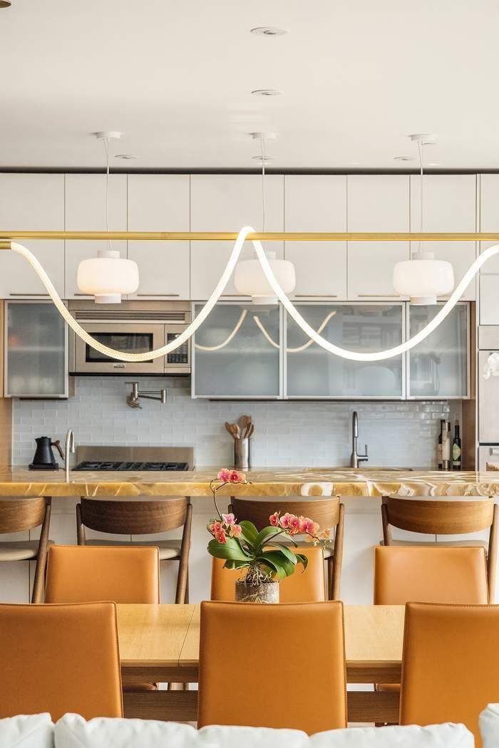 433 East 74th Street, Unit 4A Manhattan, NY 10021 - Photo 7 of 34 a kitchen with a table and chairs