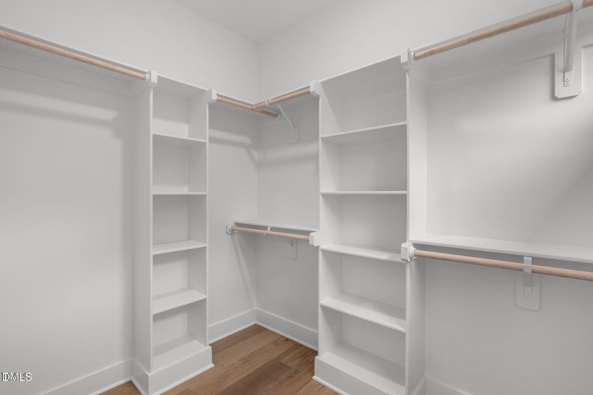 516 Edgecreek Court Raleigh, NC 27604 - Photo 18 of 26 a view of walk in closet with empty racks