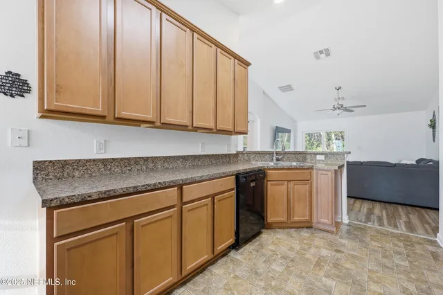 a en suite bathroom with a double sink and mirror