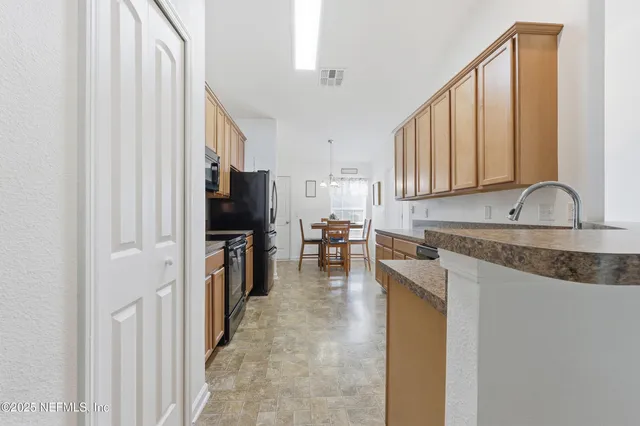 a bedroom with a bed and a bookshelf