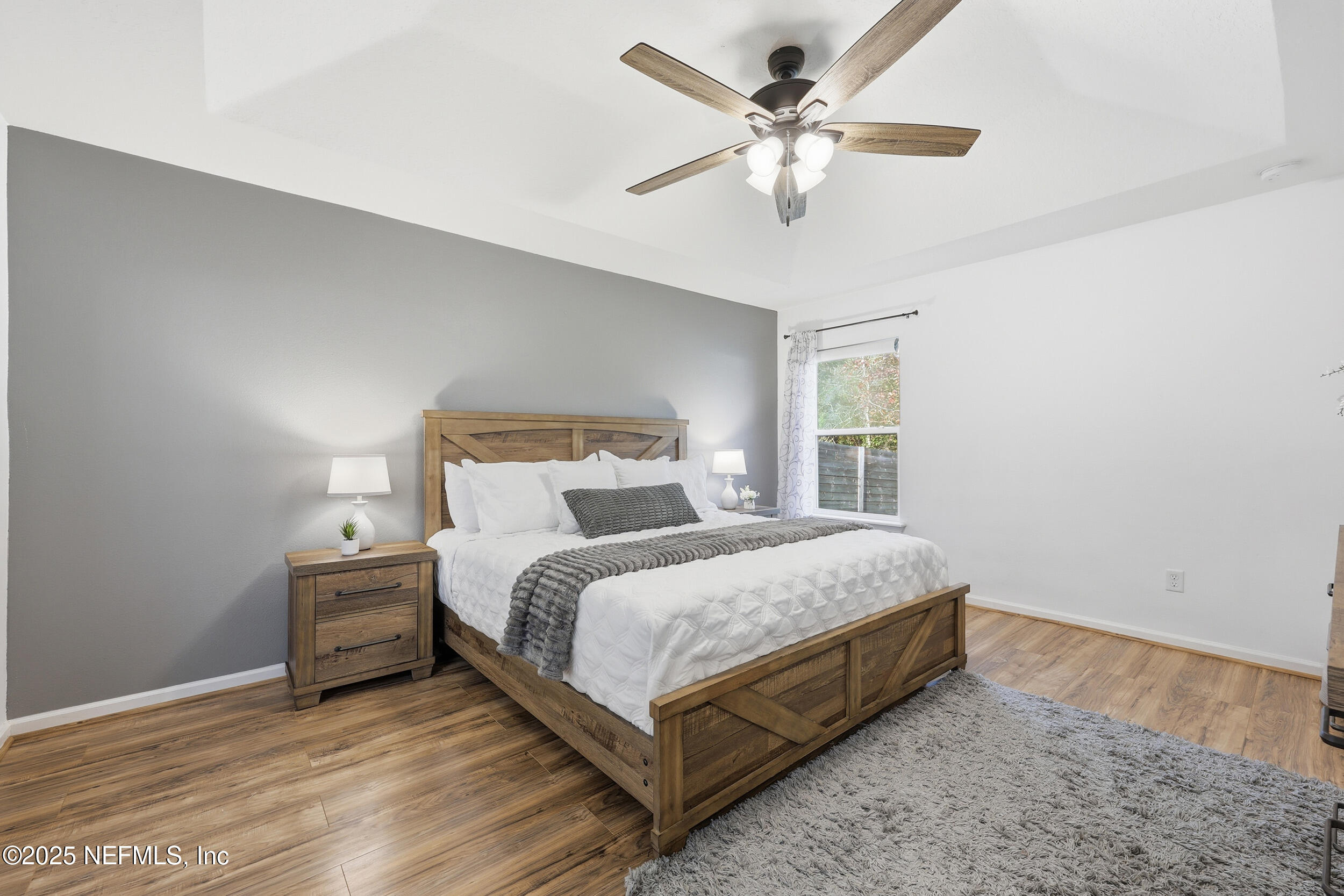 131 North Twin Maple Road St. Augustine, FL 32084 - Photo 15 of 55 a bedroom with a large bed and a ceiling fan
