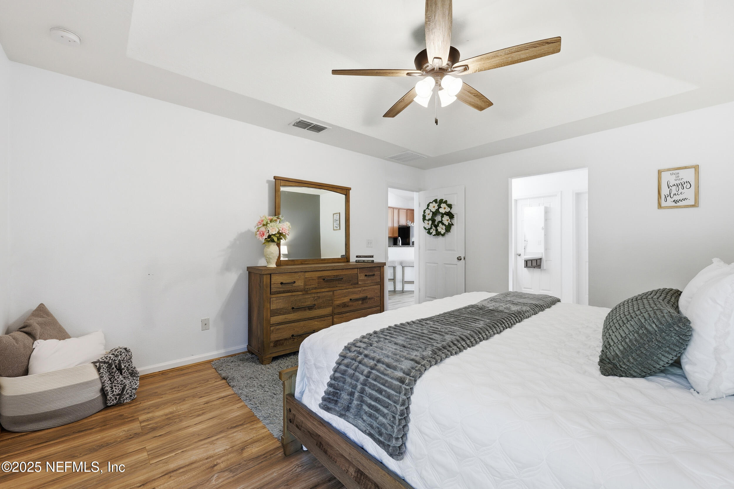 131 North Twin Maple Road St. Augustine, FL 32084 - Photo 17 of 55 a bedroom with a bed and wooden floor