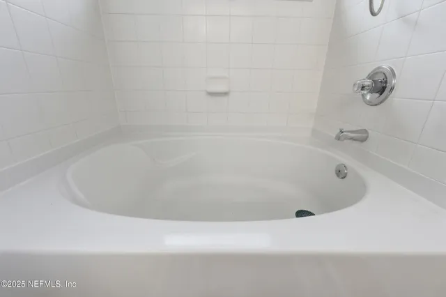 an aerial view of a house with a swimming pool