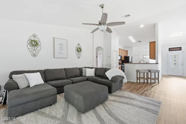 a living room with furniture and a window