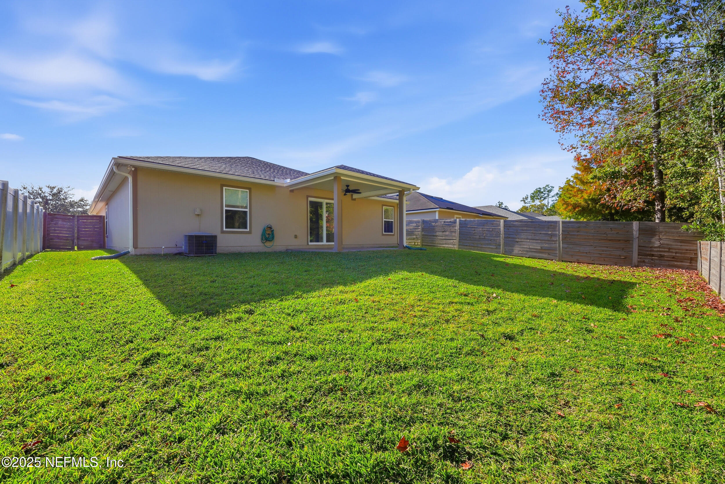131 North Twin Maple Road St. Augustine, FL 32084 - Photo 40 of 55 a view of a house with a yard and sitting area