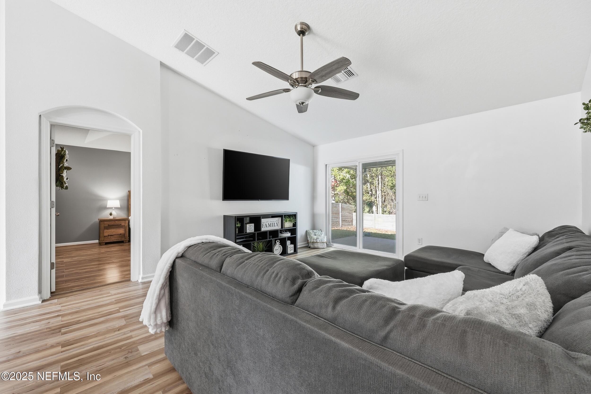 131 North Twin Maple Road St. Augustine, FL 32084 - Photo 5 of 55 a living room with furniture and a flat screen tv