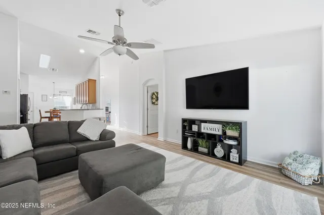 a kitchen with stainless steel appliances granite countertop a stove a refrigerator and a microwave