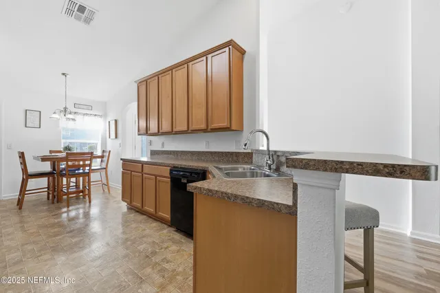 a bedroom with a large bed and a ceiling fan