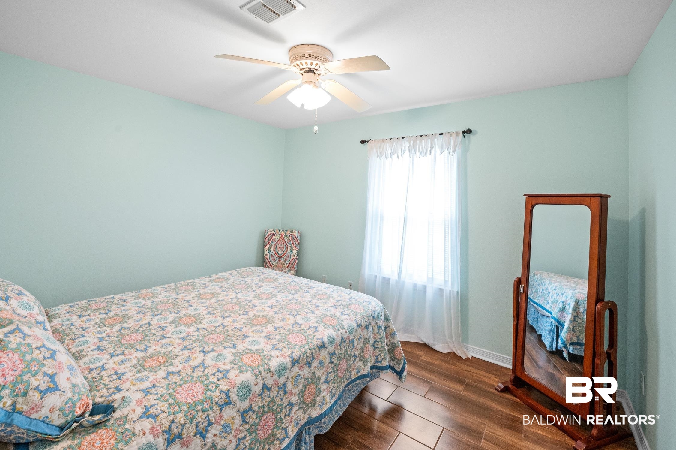 2553 Santa Rosa Drive Lillian, AL 36549 - Photo 29 of 51 Bedroom featuring baseboards, visible vents, dark wood finished floors, and a ceiling fan