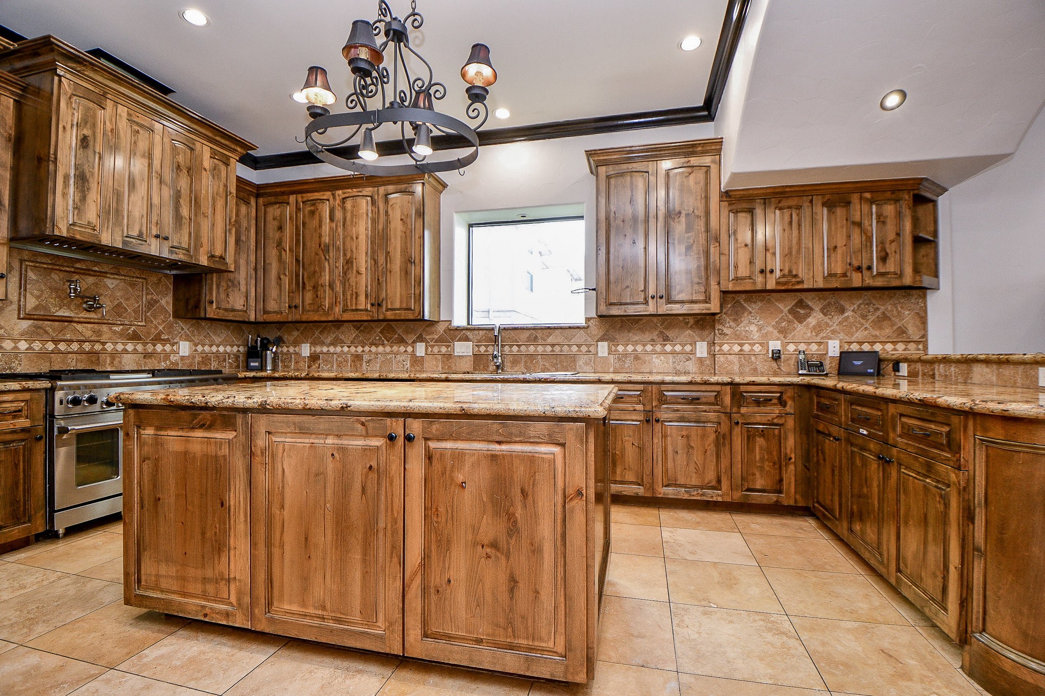 4119 Allen Street Houston, TX 77007 - Photo 28 of 50 a kitchen with stainless steel appliances granite countertop wooden cabinets a sink and dishwasher