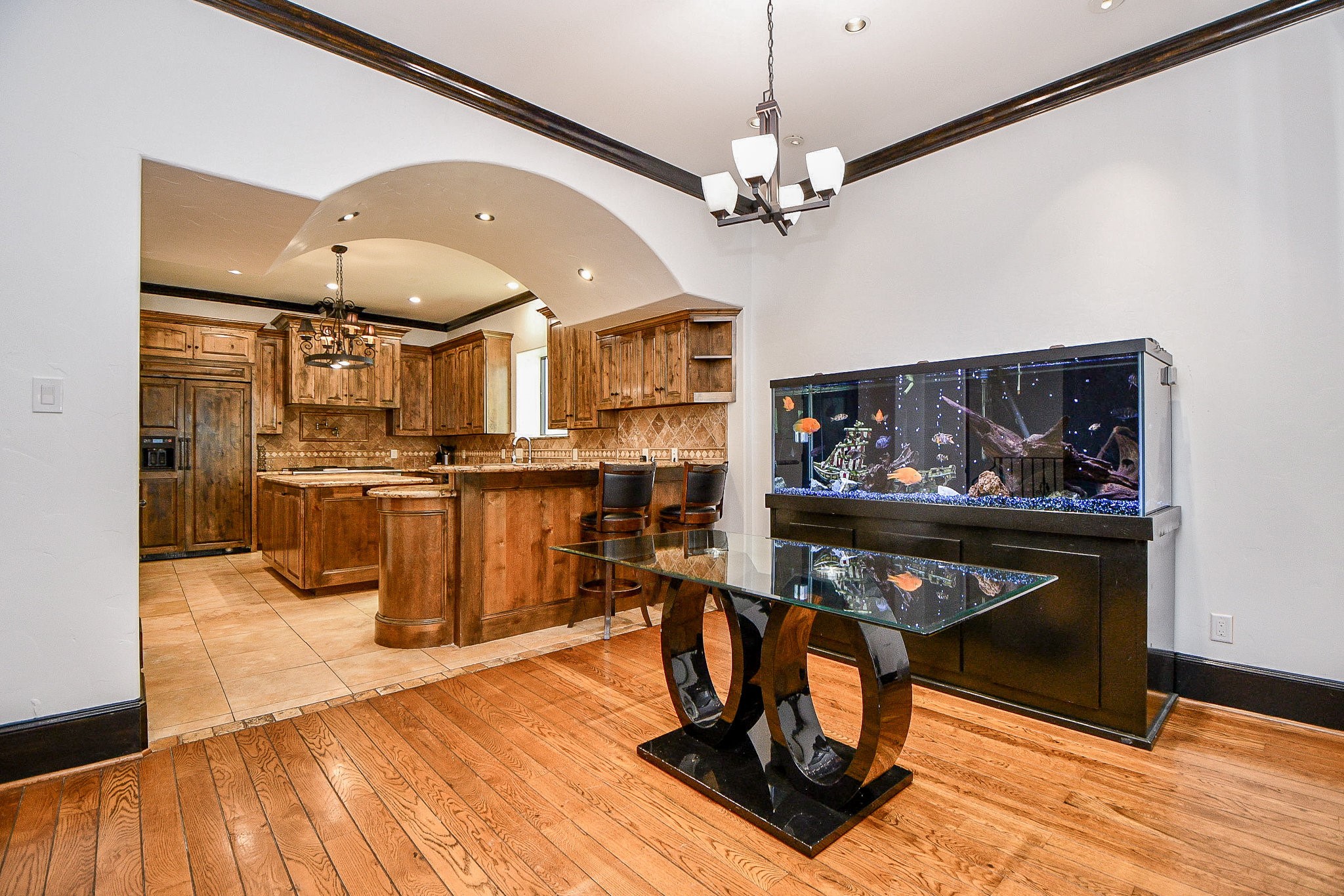 4119 Allen Street Houston, TX 77007 - Photo 29 of 50 a view of a dining room with furniture a kitchen and chandelier