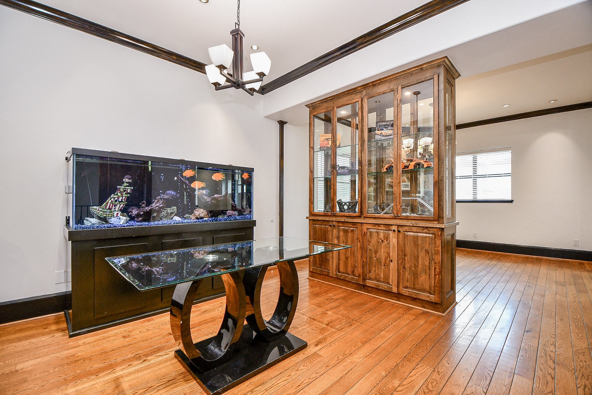 4119 Allen Street Houston, TX 77007 - Photo 30 of 50 a living room with furniture a dining table and wooden floor