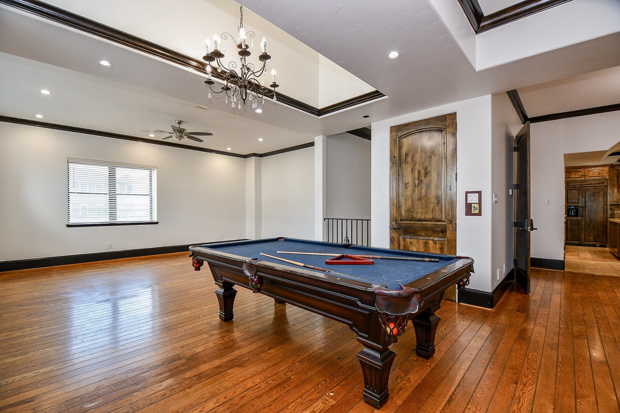 4119 Allen Street Houston, TX 77007 - Photo 32 of 50 a room with wooden floor pool table and windows