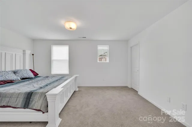 a room with a bed and cabinets