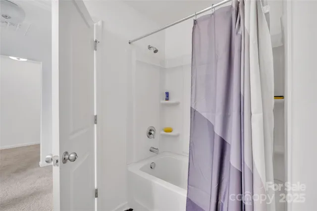 a bedroom with a bed and a chair