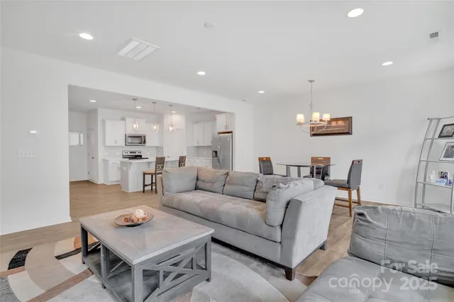 a living room with furniture and a table