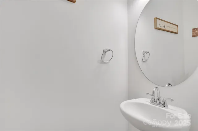 a bathroom with a sink and mirror