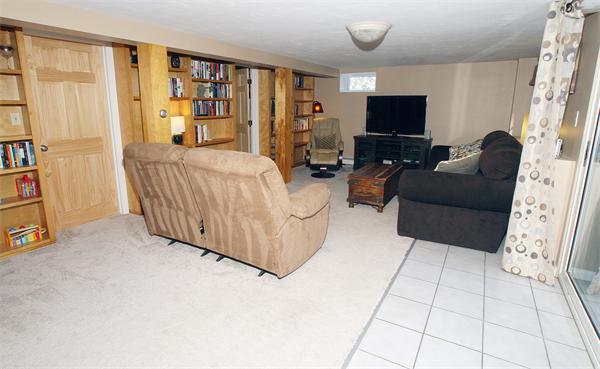 53 Hemenway Road Framingham, MA 01701 - Photo 7 of 27 a living room with furniture and a flat screen tv