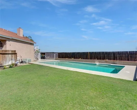 a view of swimming pool with a yard