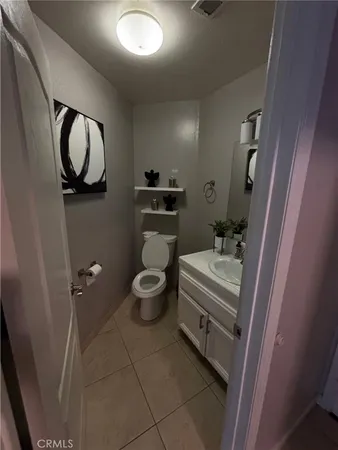 a kitchen with a refrigerator and a stove