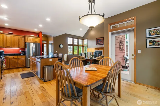 a view of a dining room with furniture window and wooden floor