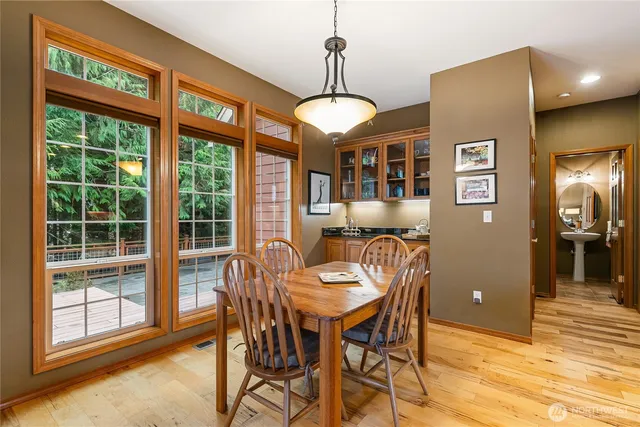 a view of a dining room with furniture window and outside view