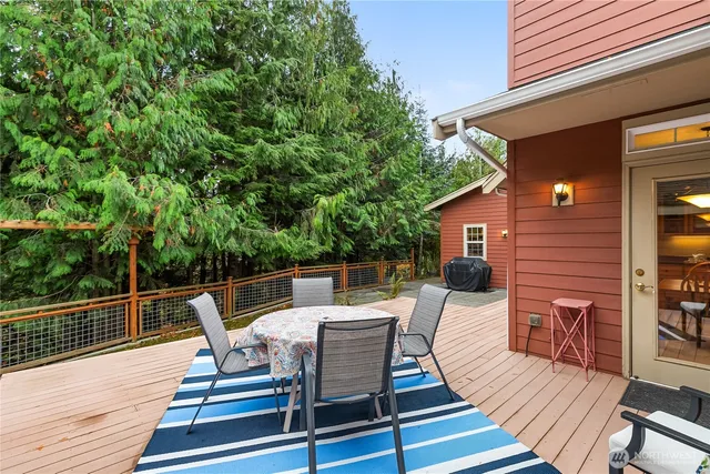 a view of a small deck with a backyard