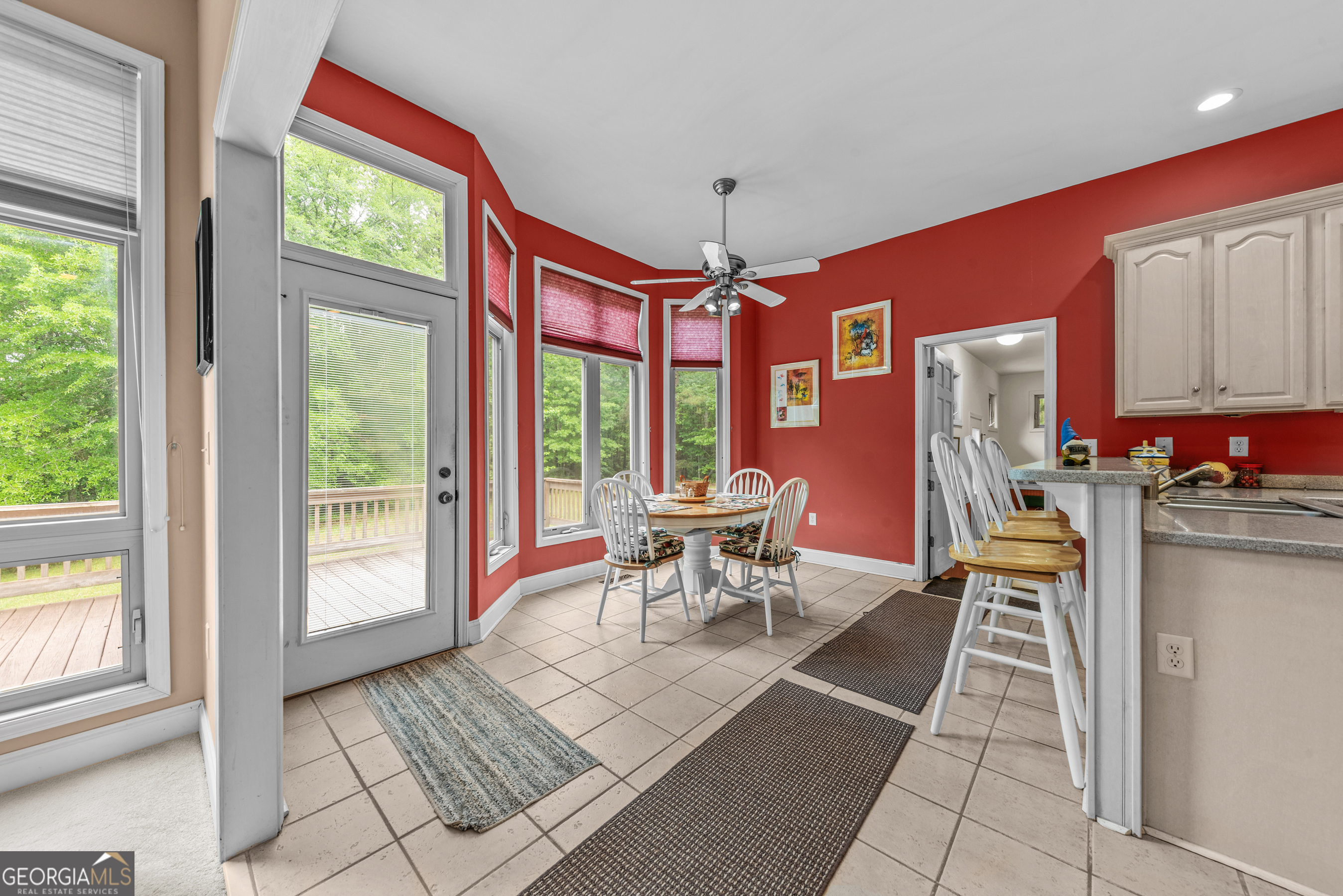 1370 Deerwood Drive Rutledge, GA 30663 - Photo 12 of 43 a dining room with furniture and a floor to ceiling window