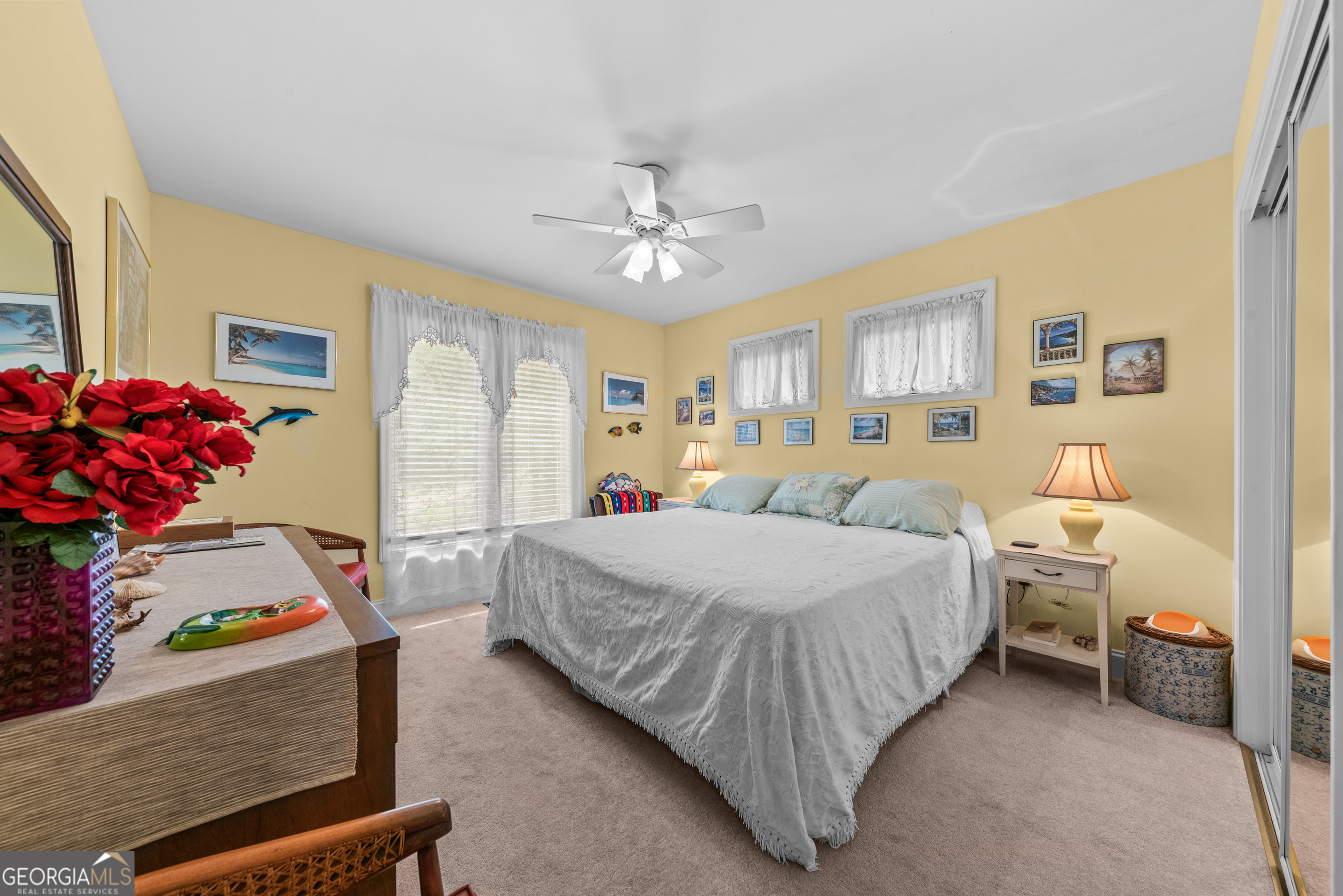 1370 Deerwood Drive Rutledge, GA 30663 - Photo 26 of 43 a bedroom with a bed and a chandelier