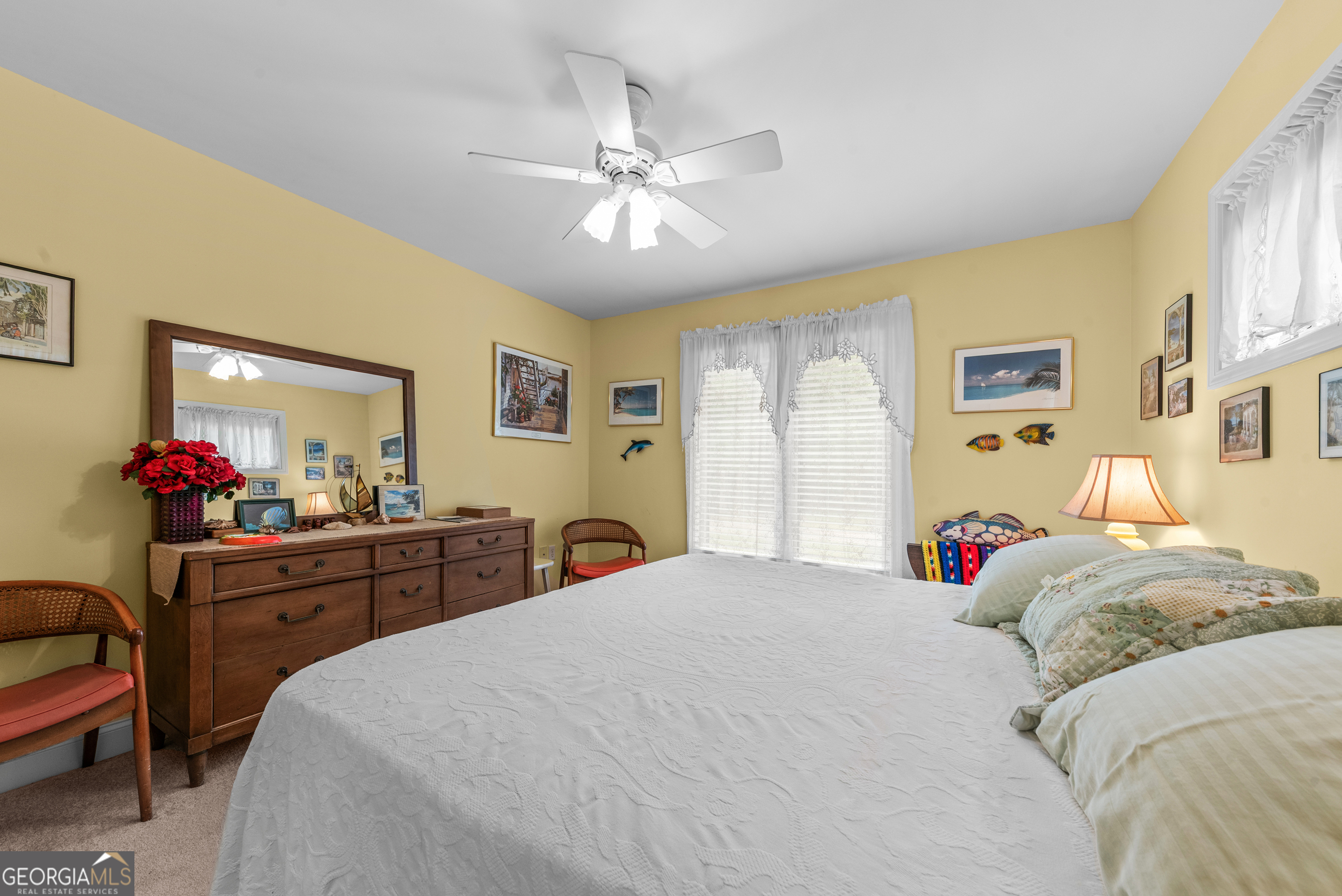 1370 Deerwood Drive Rutledge, GA 30663 - Photo 27 of 43 a bedroom with a bed and a chandelier
