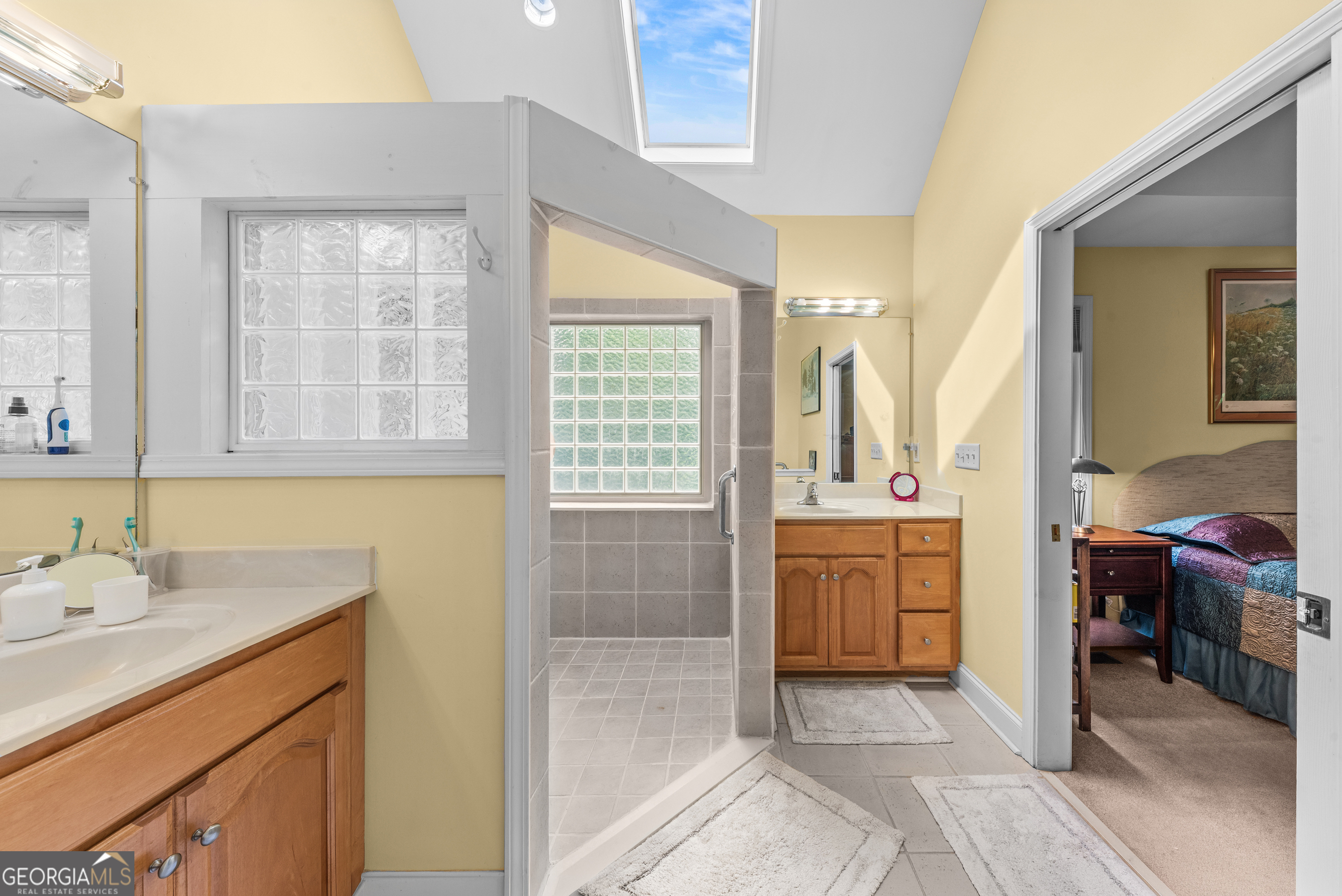 1370 Deerwood Drive Rutledge, GA 30663 - Photo 31 of 43 a bathroom with a sink a mirror and a bathtub