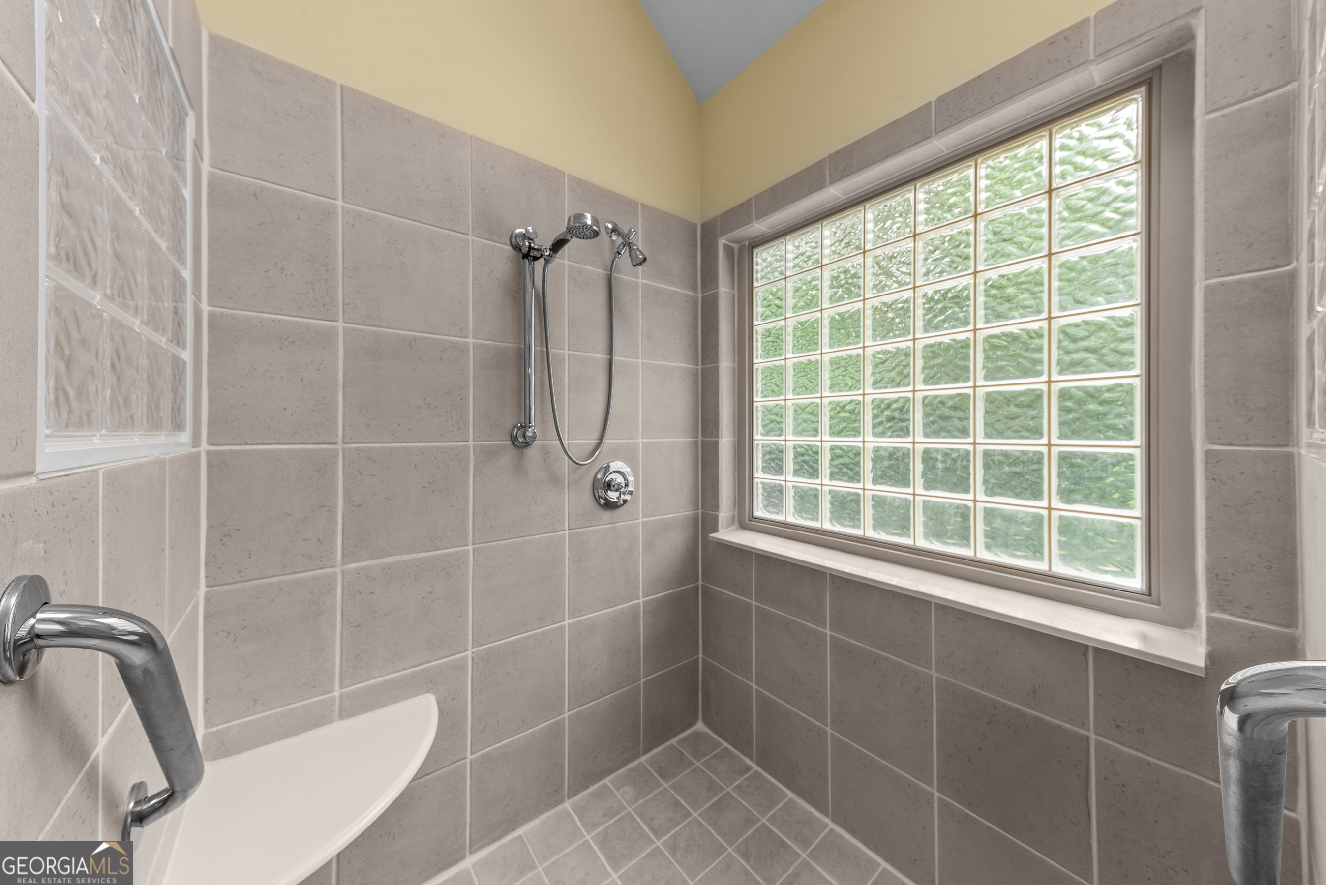 1370 Deerwood Drive Rutledge, GA 30663 - Photo 32 of 43 a bathroom with a window and a shower