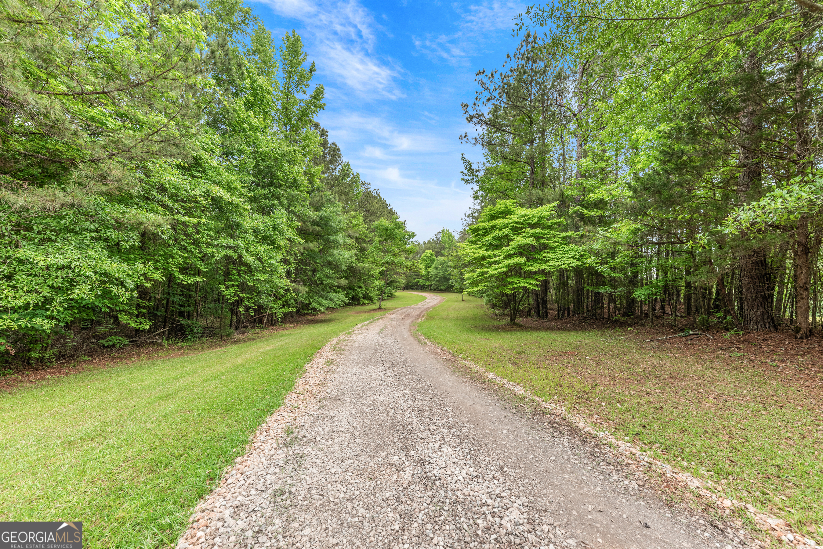 1370 Deerwood Drive Rutledge, GA 30663 - Photo 40 of 43 a view of a yard with plants and trees