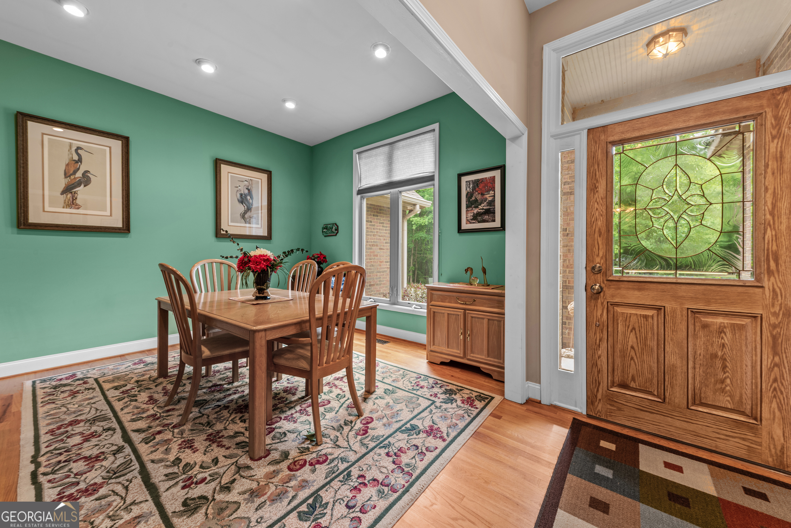 1370 Deerwood Drive Rutledge, GA 30663 - Photo 5 of 43 a view of a dining room with furniture window and wooden floor