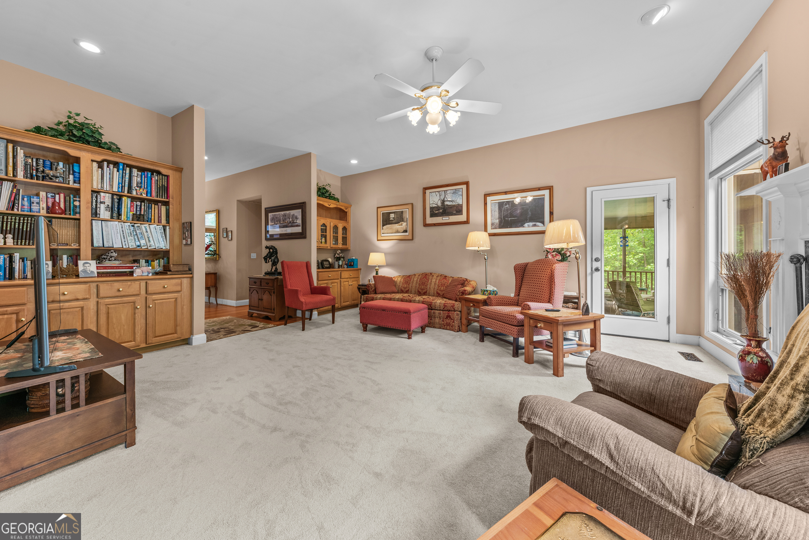 1370 Deerwood Drive Rutledge, GA 30663 - Photo 10 of 43 a living room with furniture and a flat screen tv